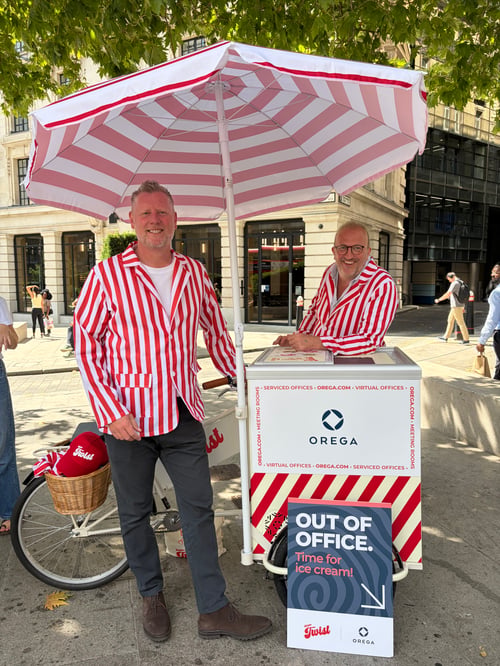 Two men in red and white striped blazers beside the Orega ice cream cart during the Orega x Mister Twist activation